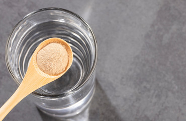 Amla powder and glass with water - Phyllanthus emblica.
