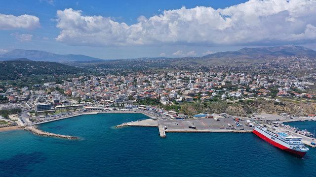 Aerial drone bird's eye panoramic view of famous port and city of Rafina with passenger ferries travel to Aegean islands, Attica, Greece