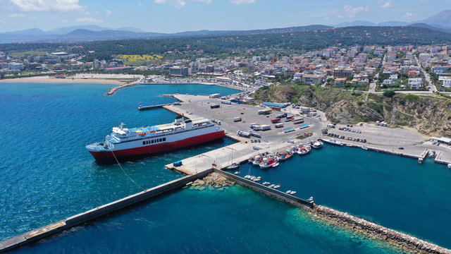 Aerial drone bird's eye panoramic view of famous port and city of Rafina with passenger ferries travel to Aegean islands, Attica, Greece