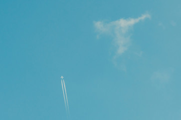 The plane is far in the sky