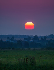 Bright Sun under the horisont at the country view landscape