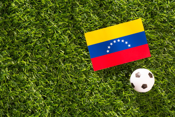 Fototapeta premium Soccer of Venezuela, flag and ball on grass.