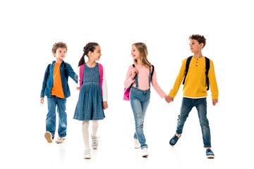 Obraz premium full length view of schoolchildren holding hands isolated on white