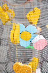 Yellow foam heart shapes hanging in Wire cage Decorate in wedding love garden. Valentines day concept.