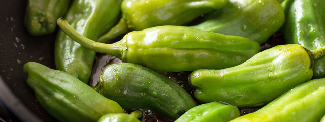 Green Padron Peppers in the Frying Pan. Pimientos de Padron.