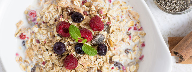 Healthy Breakfast Muesli With Milk, Chia Seeds, Berries and Cinnamon. Sunny Morning.