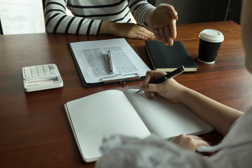Woman talking with colleague about new startup project.Business people brainstorming concept