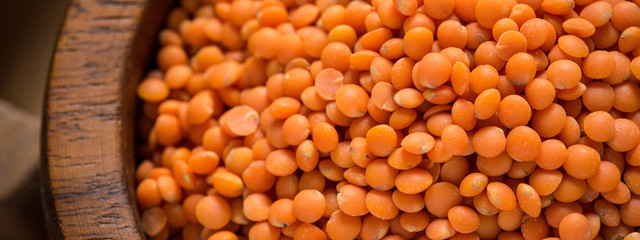 Red Lentils in Bowl on Wooden Table