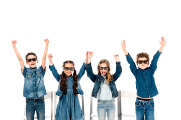 four happy kids in 3d glasses waving hands isolated on white