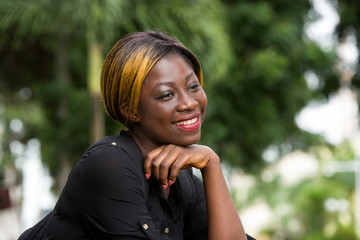 smiling student girl sitting outside