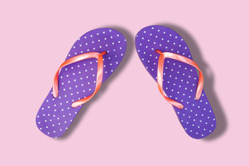 Flip flops isolated over pink 