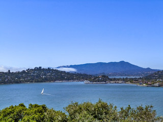 Skyline of Angel Island in San Francisco, California with sailboat and houses