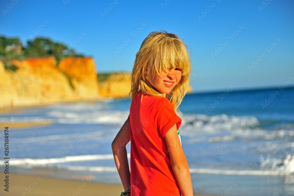 Wall mural portrait of a smiling boy outdoors