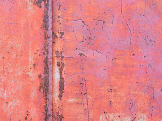 Old paint on metal surface, rust stains.