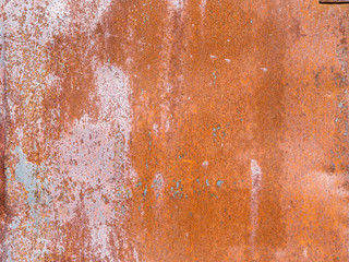 Old paint on metal surface, rust stains.
