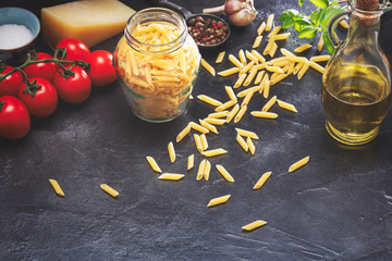 Delicious Italian pasta in miniature. Dry pasta background