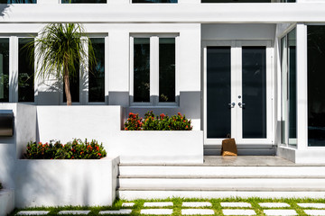 Luxury modern entrance architecture of house in Florida city on sunny day, property real estate...