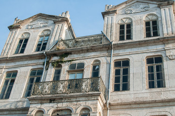Old retro weathered vintage neglected house stone slabs facade