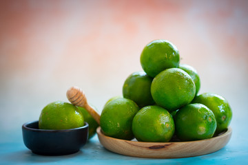 Lots of fresh green lemons fruits