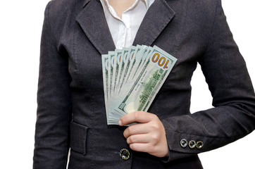 Female hands hold dollars on a white background.