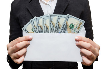 Female hands hold white envelope with dollars. White background.