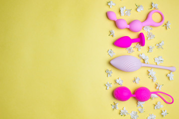 Different sex toys set on a light background.