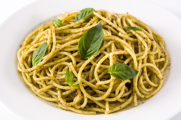 Spaghetti pasta with pesto sauce isolated on white background.