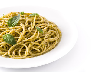 Spaghetti pasta with pesto sauce isolated on white background.