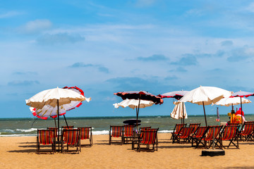 Colorful beds and umbrella on a tropical beach