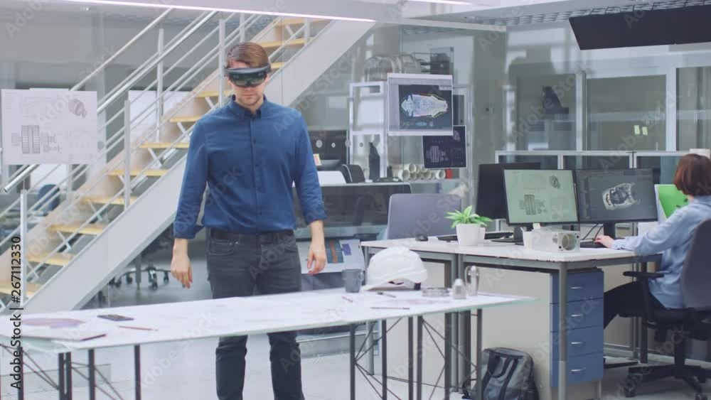 Aufkleber Engineering Software Developer Wearing Virtual Reality Headset Uses Gestures to Interact with Augmented Reality while Designing Industrial Engine Model in Modern Facility. AR Mock-up Concept