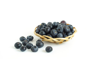 Healthy food blueberries fruit in basket High vitamin Anthocynins benefit for heart and blood circulatory system isolated on white background
