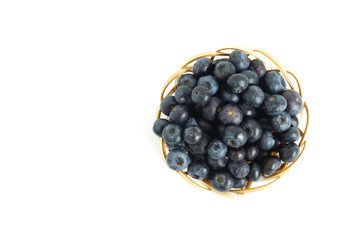 Healthy food blueberries fruit in basket High vitamin Anthocynins benefit for heart and blood circulatory system isolated on white background