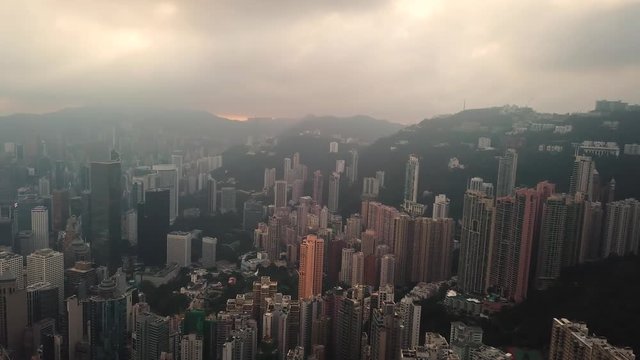 Aerial View drone 4k footage Of Modern Skyscrapers In Hong Kong City. buildings in Hong Kong city on sunrise.