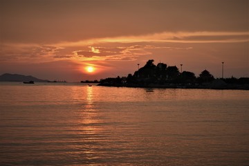 Fototapeta na wymiar Silhouette sea horizon scenic in summer sunset of Ko Loi island, Chonburi Thailand