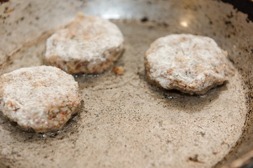 Cutlets are roasted in an old frying pan. Buckwheat cutlets. Buckwheat cutlets are fried. Veggie cutlets. natural food.