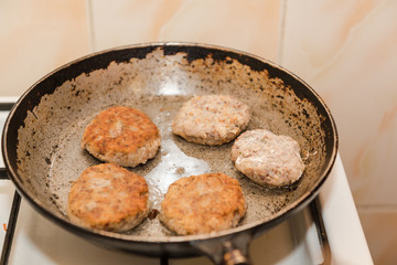 Cutlets are roasted in an old frying pan. Buckwheat cutlets. Buckwheat cutlets are fried. Veggie cutlets. natural food.