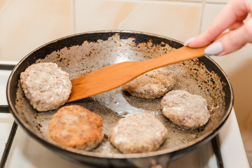 Cutlets are roasted in an old frying pan. Buckwheat cutlets. Buckwheat cutlets are fried. Veggie cutlets. natural food.