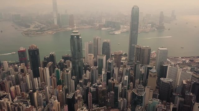 Aerial View drone 4k footage Of Modern Skyscrapers In Hong Kong City. buildings in Hong Kong city on sunrise.