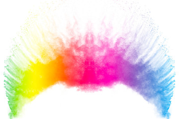 Colorful powder explosion on white background.Colored dust particle splash.Painted Holi.
