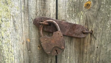 padlock on old wooden door