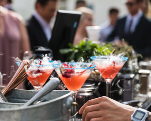 waiter serving drinks in restaurant