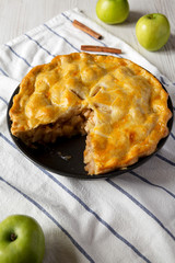 Homemade apple pie dessert on cloth, low angle view. Close-up.