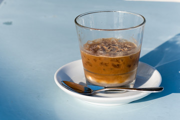 Cold coffee with ice close up