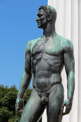 statue of a naked man in a park (volksgarten) in vienna (austria)