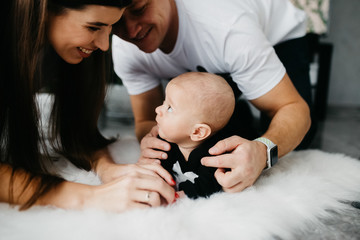 Portrait of a happy family with a little baby boy.