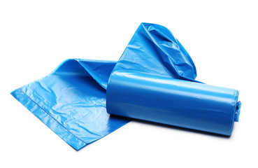 Blue plastic garbage bag roll isolated on white background