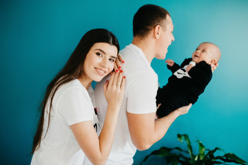 Portrait of a happy young family with a little baby boy.