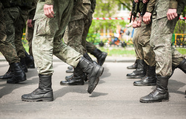 Marching soldiers in military boots