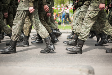 Marching soldiers in military boots