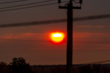 Electric pole at sunset as background